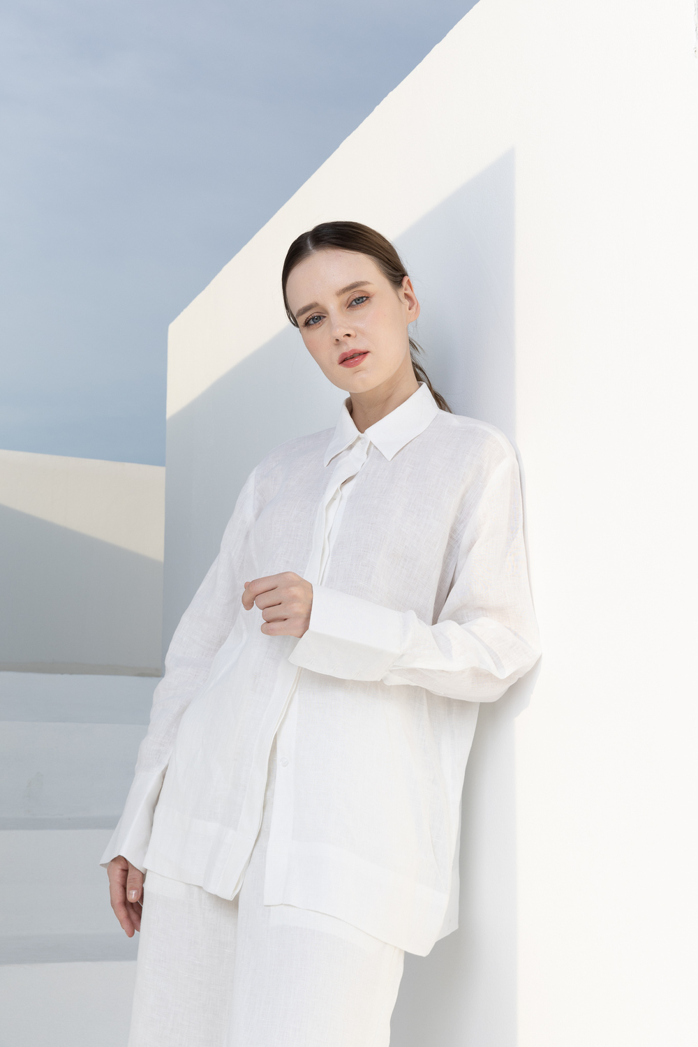 POYA The Linen Hours collection, crisp white Belgian linen shirt and trousers, rooftop editorial