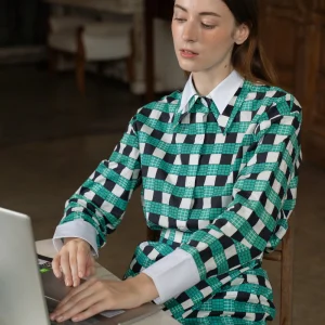 POYA green check dress, working from a cafe table