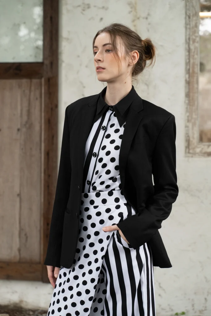POYA black blazer over polka and stripe dress
