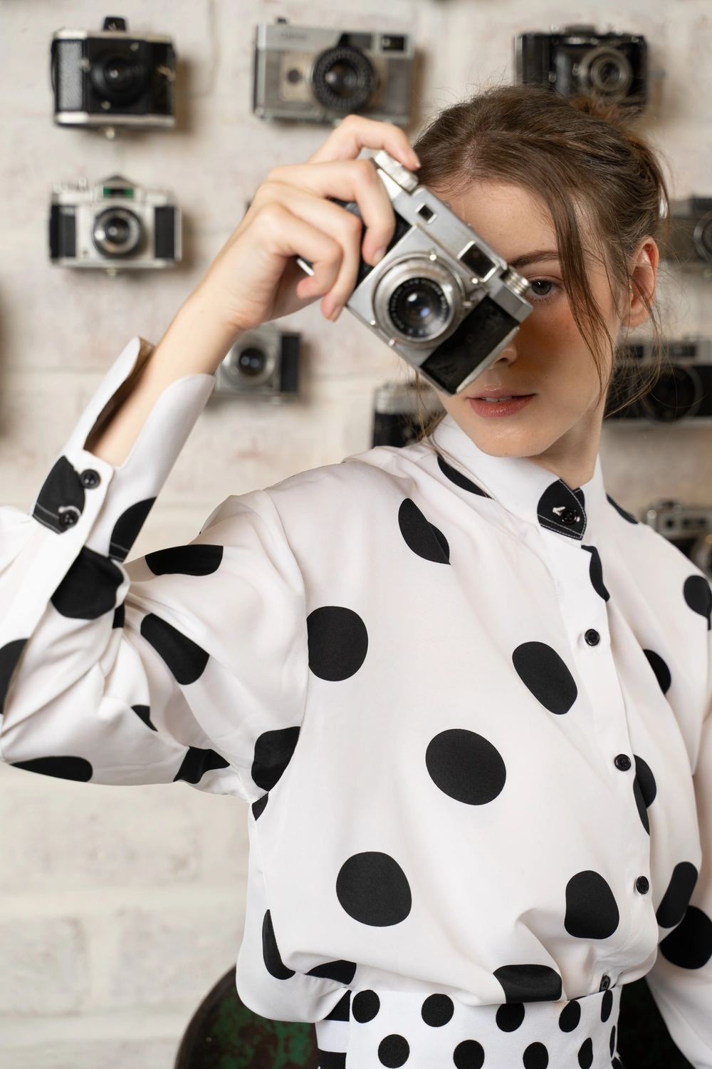 POYA black and white polka blouse, editorial portrait