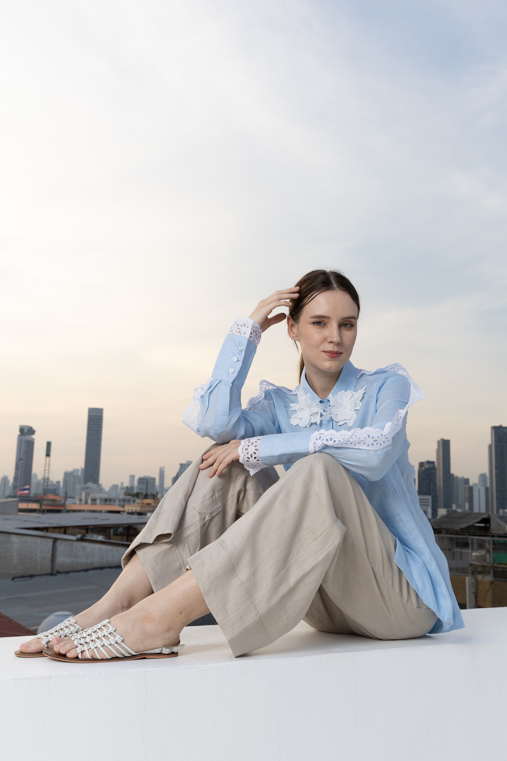 POYA Old Money collection, quiet luxury rooftop editorial in blue and beige linen